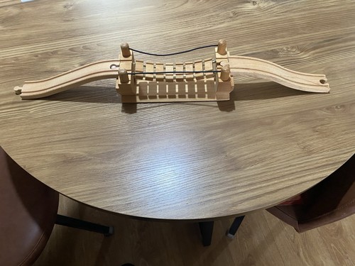 Wooden train track rope bridge - train,